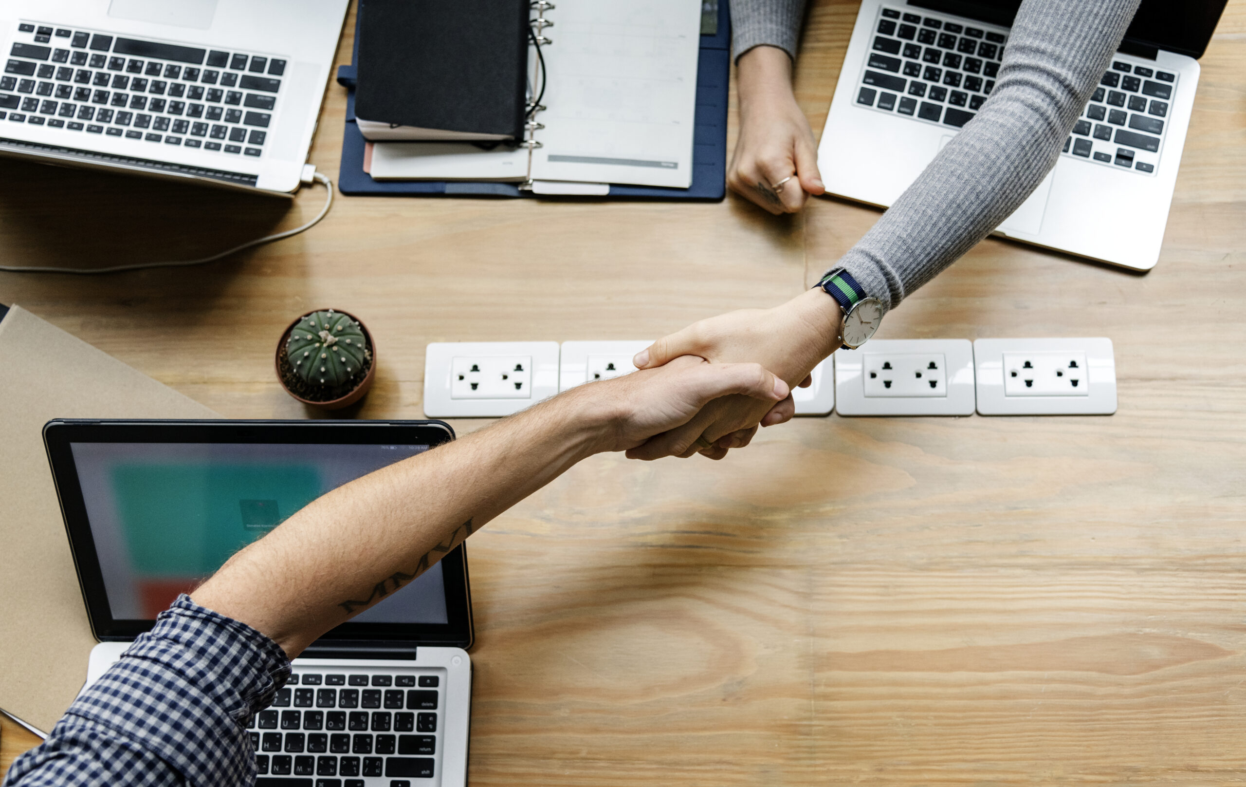 Business people shaking hands in agreement